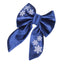 A blue satin bow with white snowflake designs on it.
