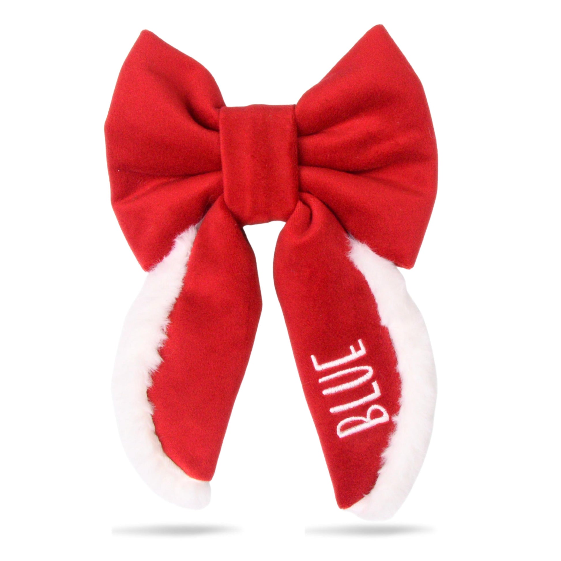 A red bow with white fur trim and the word &quot;BLUE&quot; written on it.