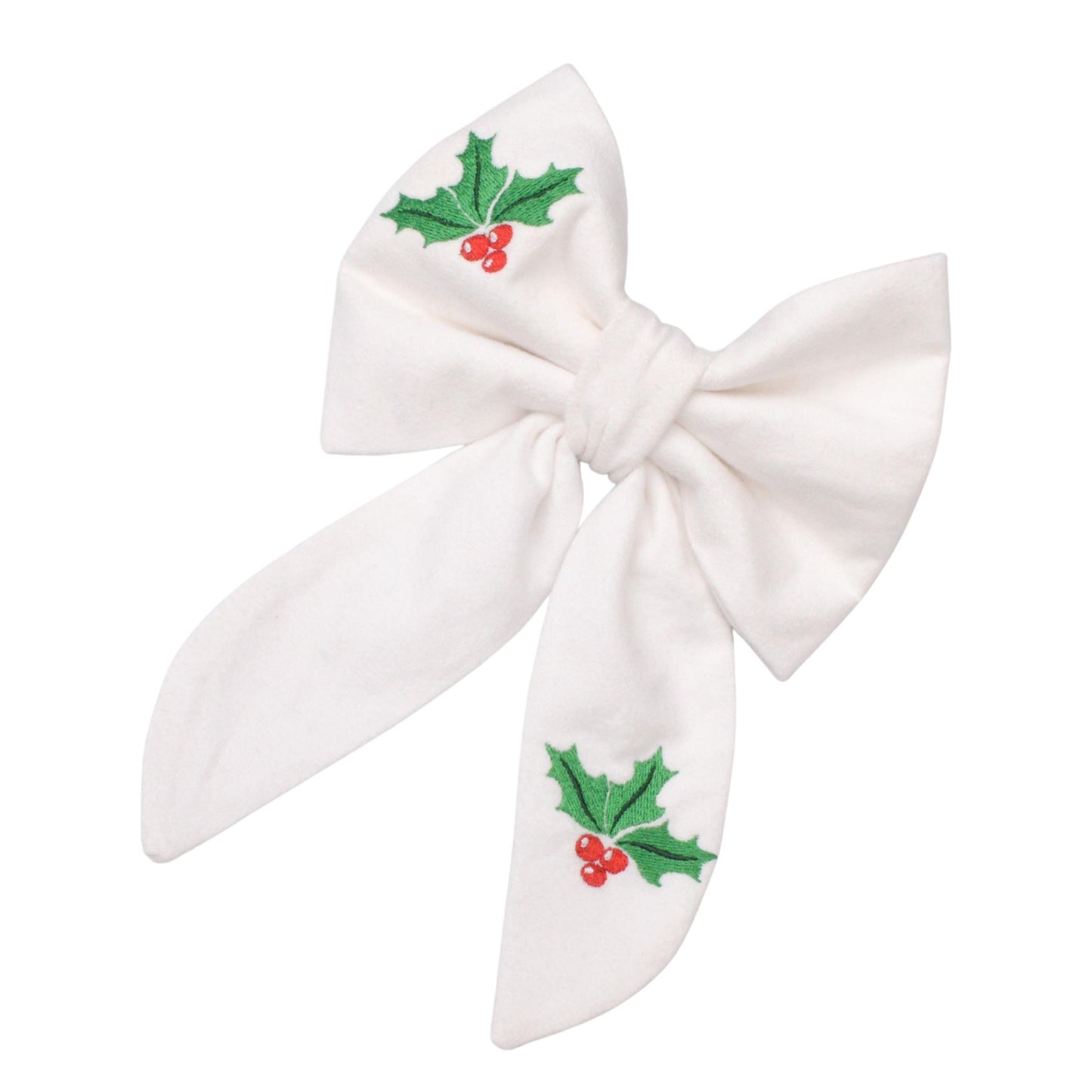A white bow with green holly leaves and red berries embroidered on it.