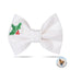 A white bow tie with a holly leaf and red berries embroidered on it.